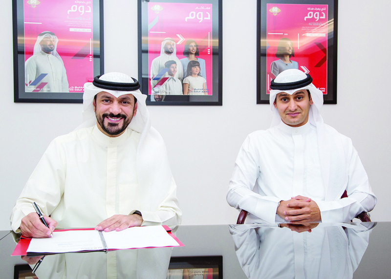 KUWAIT: Ahmad Al-Amir, Assistant General Manager of Corporate Communications at Gulf Bank (left) and Ahmad Al-Huzami, CEO of Suffix Sports Management sign the agreement.n