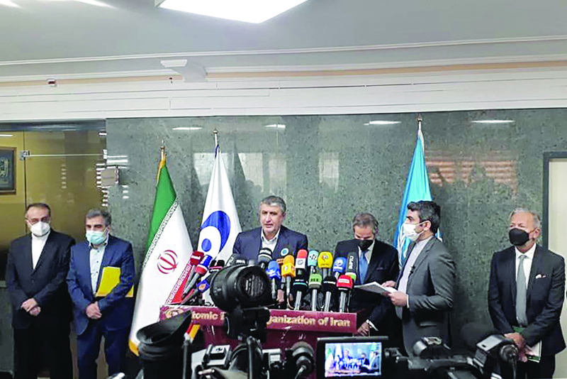 TEHRAN: A handout picture provided by Atomic Energy Organization of Iran (AEOI) shows the Director General of the International Atomic Energy Agency, Rafael Grossi (C-R) and the Head of Iran's Atomic Energy Organization Mohammad Eslami (C-L) giving a press conference in the capital Tehran. - AFPnn