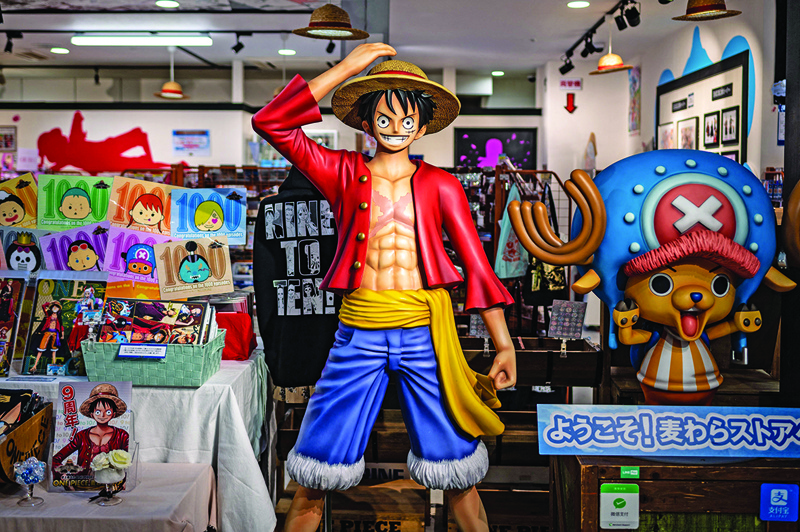A statue of character Monkey D Luffy, also known as Straw Hat, is displayed at the “One Piece” anime souvenir shop in Tokyo.—AFP photosn