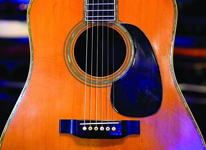 Eric Clapton's 1968 Martin D-45 acoustic guitar is on display during a press preview.—AFP photosn