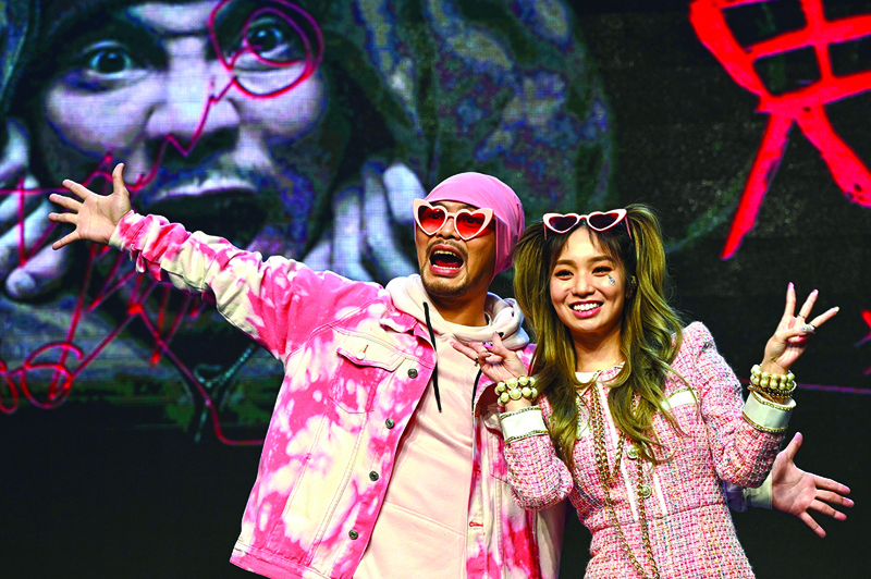 Malaysian rapper Wee Meng Chee (left), known by his stage name Namewee, and Taiwan-based Australian singer Kimberley Chen, take part in a press conference together in Taipei yesterday.-AFP n