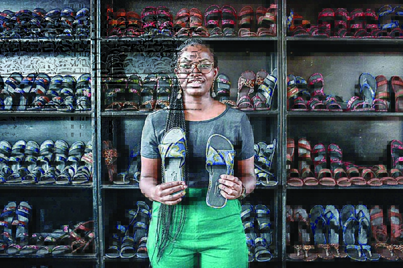 Ysolde Shimwe, co-creator of Uzuri K&Y shoe brand, speaks during an interview at the factory in Kigali. - AFP photosn
