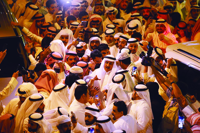 KUWAIT: Former opposition MPs Musallam Al-Barrak (left) and Khaled Al-Tahous are welcomed by supporters after they arrived in Kuwait after being pardoned by the Amir. – Photos by Yasser Al-Zayyat and Fouad Al-Shaikhn