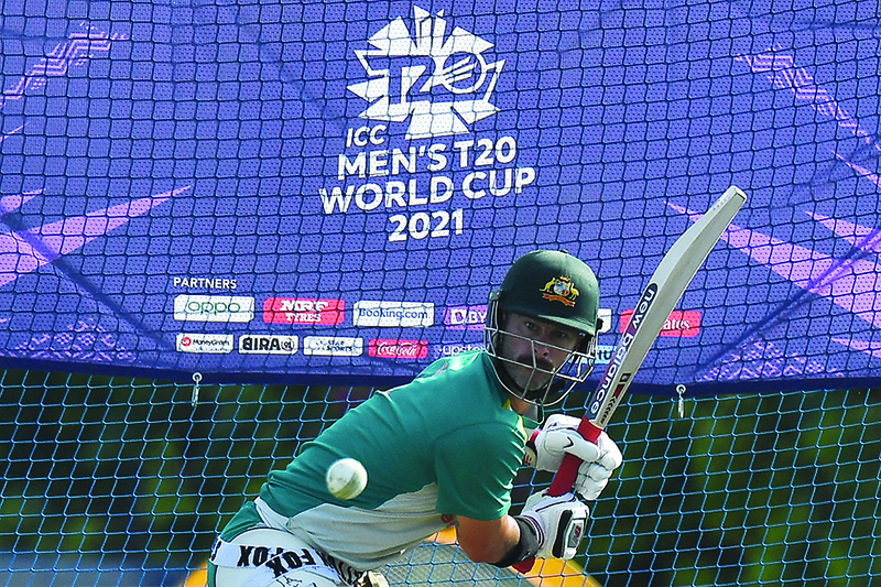 DUBAI: Australia’s Matthew Wade plays a shot on the nets during a practice session at the ICC academy in Dubai yesterday, ahead of tomorrow’s Twenty20 World Cup final match between Australia and New Zealand. — AFP