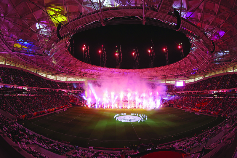 DOHA: In this file fisheye photo taken on October 22, 2021 shows fireworks illuminating the venue during the opening ceremony of the Al-Thumama Stadium in the capital Doha, ahead of the Amir Cup final football match between Al-Sadd and Al-Rayyan. - AFPn