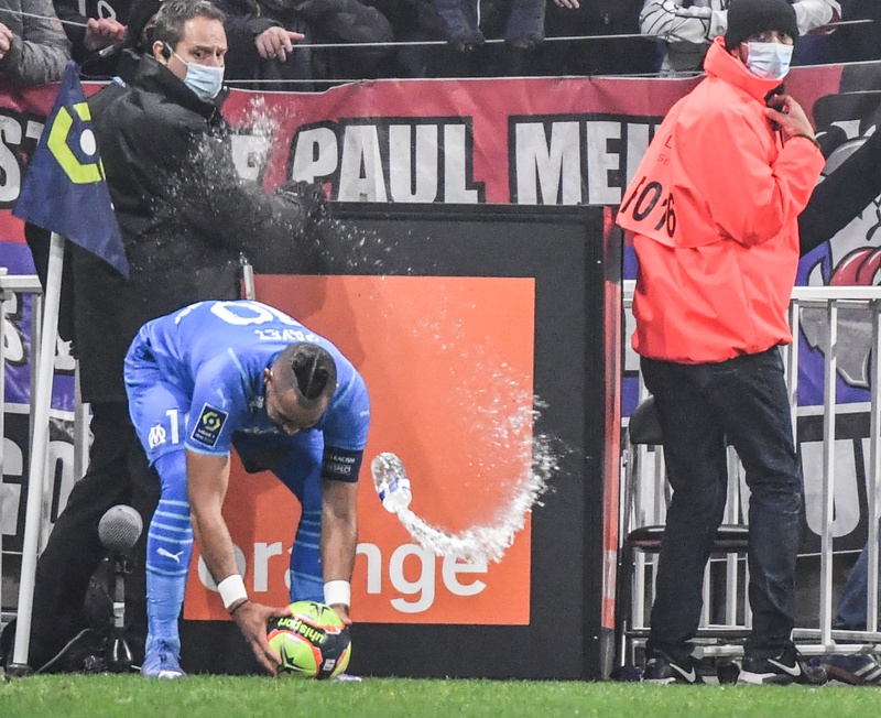 DECINES-CHARPIEU: Marseille's French midfielder Dimitri Payet receives a bottle of water from the grandstand during the French L1 football match against Lyon at the Groupama stadium in Decines-Charpieu, near Lyon, south-eastern France, on Sunday. - AFPnn