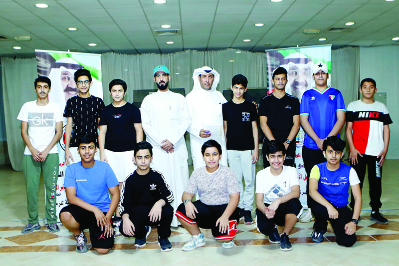 KUWAIT: Participants in the junior's 10-meter pistol and rifle contest of the HH the Crown Prince Shooting Tournament pose for a group photo after the final held at Kuwait Shooting Sport Club's Jahra branch.n