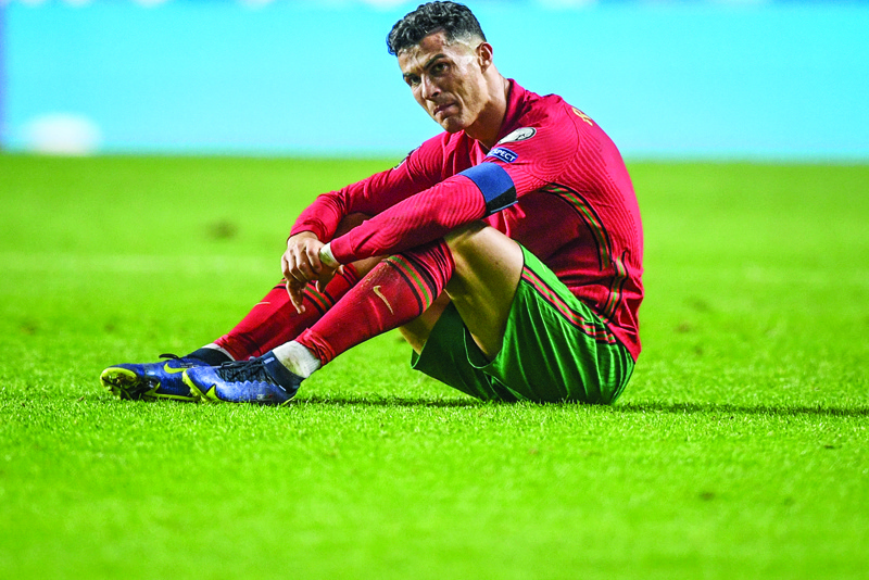LISBON: In this file photo taken on November 15, 2021 Portugal's forward Cristiano Ronaldo reacts at the end of the FIFA World Cup Qatar 2022 qualification group A football match between Portugal and Serbia, at the Luz stadium in Lisbon. - AFPnn