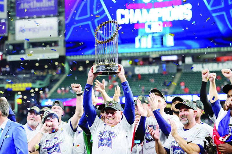 HOUSTON: Manager Brian Snitker #43 of the Atlanta Braves hoists the commissioner's trophy following the team's 7-0 victory against the Houston Astros in Game Six to win the 2021 World Series at Minute Maid Park on Tuesday in Houston, Texas. - AFPn