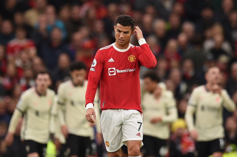 MANCHESTER: Manchester United's Portuguese striker Cristiano Ronaldo (center) reacts after Liverpool scored their third goal during the two teams’ English Premier League football match at Old Trafford in Manchester, north west England, on October 24, 2021. – AFPnn