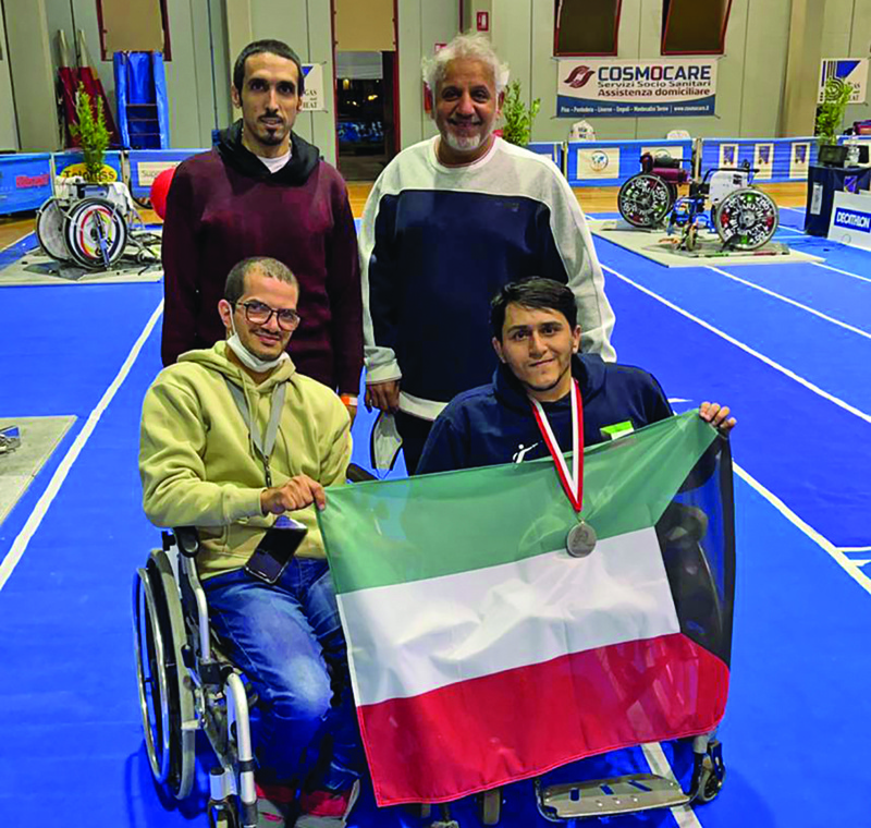 PISA: Kuwait's Paralympic fencer Suleiman Al-Tamimi (right) raises Kuwait’s flag after winning the silver medal in the men’s foil category during the IWAS Wheelchair Fencing World Cup, held currently in Pisa, Italy.nn