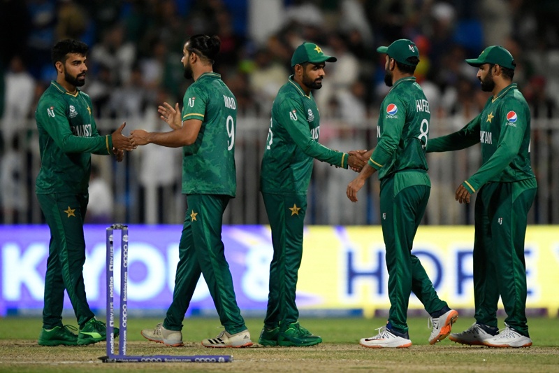 SHARJAH: Pakistan's players celebrate their win in the ICC men's Twenty20 World Cup cricket match between Pakistan and Scotland at the Sharjah Cricket Stadium on Nov 7, 2021. - AFP n