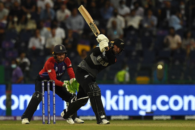 ABU DHABI: New Zealand's Devon Conway plays a shot as England's wicketkeeper Jos Buttler watches during the ICC men's Twenty20 World Cup semifinal at the Sheikh Zayed Cricket Stadium yesterday. - AFP n