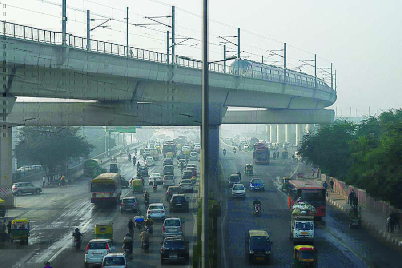 NEW DELHI: Photo shows people commute along a street amid smoggy conditions in New Delhi. New Delhi, the sprawling megacity of 20 million people is regularly ranked the world's most polluted capital, with traffic exhaust a major driver of the toxic smog that permeates the skies, especially in winter. - AFPnn