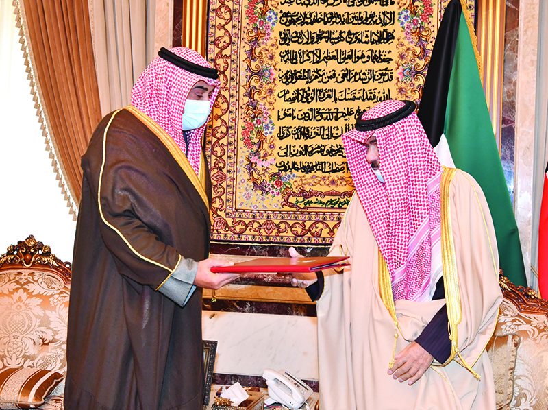 KUWAIT: His Highness the Amir Sheikh Nawaf Al-Ahmad Al-Jaber Al-Sabah receives a list of the new Cabinet’s members from His Highness the Prime Minister Sheikh Sabah Al-Khaled Al-Hamad Al-Sabah. —Amiri Diwan