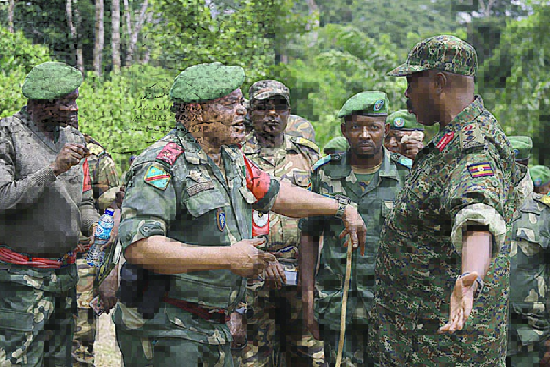 GOMA, North Kivu, DR Congo: Major General Camille Bombele (L), coordinator of the Joint Armed Forces of the Democratic Republic of the Congo (FARD) - Ugandan People’s Defence Froces (UPDF) Military Operations, and Major General Kayanja Muhanga (R), commander of the UPDF soldiers talk near the Military Camp of Semulki on the Mbau-Kamango road section. —AFP