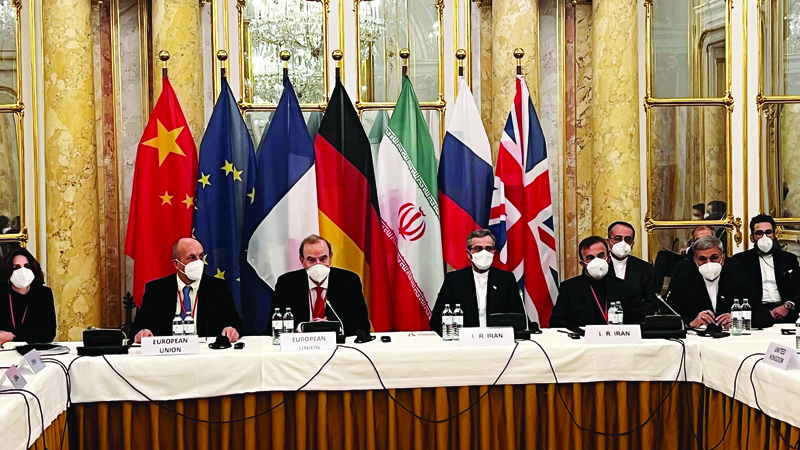VIENNA: This handout photo taken and released on December 3, 2021 by the EU delegation in Vienna shows representatives from Iran (R) and the European Union (L) attending a meeting of the joint commission on negotiations aimed at reviving the Iran nuclear deal in Vienna, Austria. - AFPnnnn