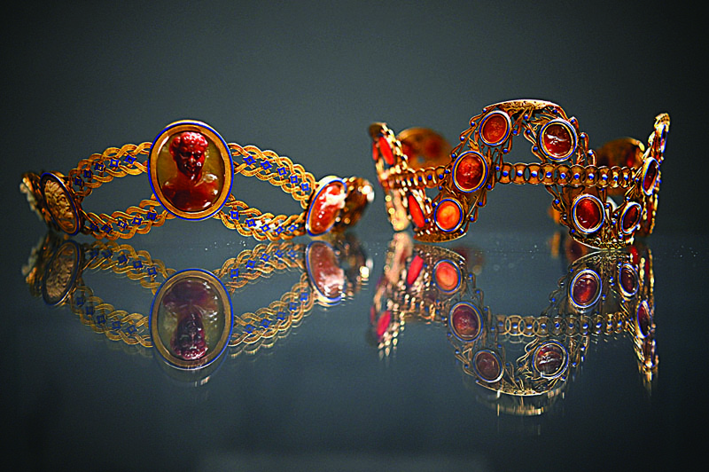 A gold, cameo and enamel diadem by Jacques-Amboise Oliveras, circa 1808, (left) and a Carnelian, enamel and gold diadem, circa 1800, (right), believed to have belonged to Empress Josephine Bonaparte of France, are displayed during 0a photocall at Sotheby's auction house in London.-AFP n