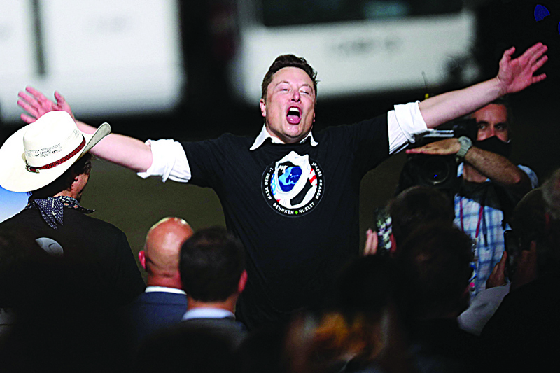In this file photo, Spacex founder Elon Musk celebrates after the successful launch of the SpaceX Falcon 9 rocket with the manned Crew Dragon spacecraft at the Kennedy Space Center in Cape Canaveral, Florida. - AFP n