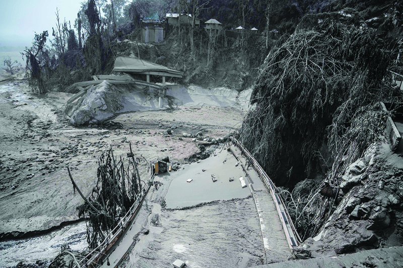 LUMAJANG, East Java: An area is seen covered in volcanic ash at Sumber Wuluh village in Lumajang yesterday, after the Semeru volcano eruption that killed at least 13 people. - AFPnnn