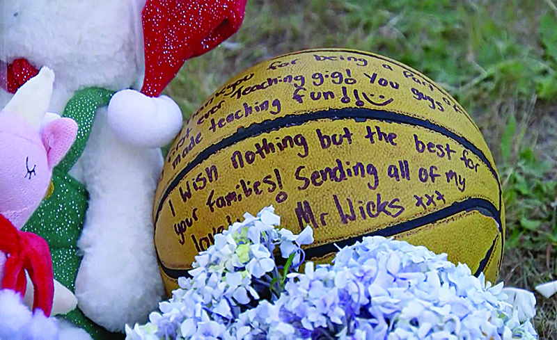 DEVONPORT, Tasmania, Australia: This screengrab taken from video released by Australian broadcaster ABC shows cuddly toys and messages left at a makeshift memorial outside the Hillcrest Primary School the day after five children died and four others were injured when a bouncy castle was blown into the air at an end-of-term school party. —AFP