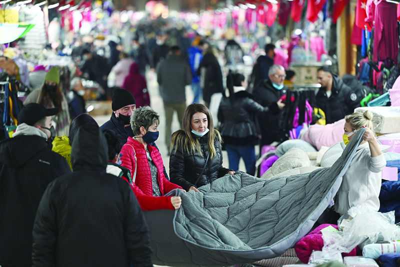 EDIRNE, Turkey: Tourists shop in a bazaar in Edirne, near Bulgaria border in Turkey. —AFP