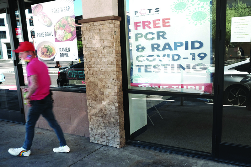 PHOENIX, US: A sign advertises COVID testing in downtown Phoenix where new COVID-19 cases are down but health experts warn cases may rise with the introduction of the Omicron strain on Saturday. —AFP