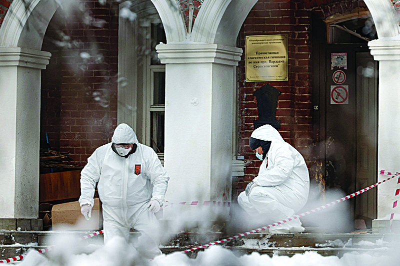SERPUKHOV: Experts work at the entrance to the Orthodox gymnasium of the Vvedenskiy Vladychniy convent after an 18-year-old graduate of this educational institution entered the school and blew himself up, in the city of Serpukhov, 100 kilometres (60 miles) south of Moscow, yesterday. - AFPnnn