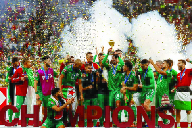AL KHOR: Algeria’s players celebrate winning the FIFA Arab Cup 2021 final at the Al-Bayt stadium in the Qatari city of Al-Khor yesterday. — AFP