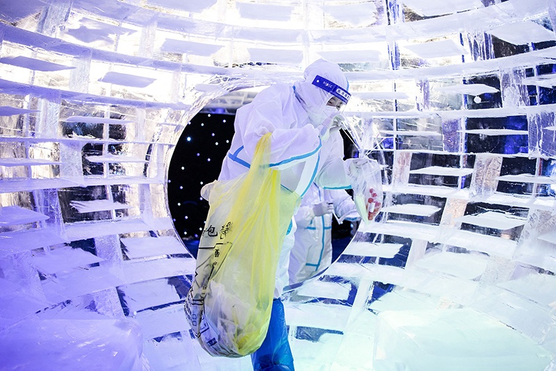 WUHAN: This photo taken on Tuesday shows a health worker collecting samples to be tested for COVID-19 at an ice and snow theme park. —AFP