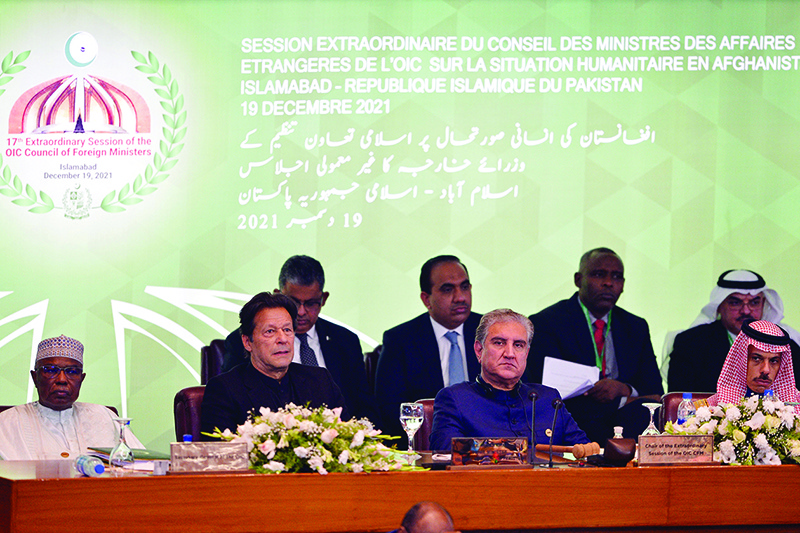 ISLAMABAD: (From left) Secretary of Organization of Islamic Cooperation Hissein Brahim Taha, Pakistan’s Prime Minister Imran Khan, his Foreign Minister Shah Mahmood Qureshi and Saudi Arabia’s Minister of Foreign Affairs Prince Faisal bin Farhan Al-Saud attend the opening of a special meeting of the OIC yesterday. — AFP