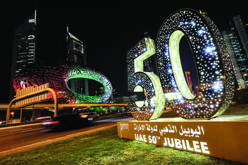 DUBAI: A sign marking the UAE's 50th jubilee is lit up along the side of Sheikh Zayed Road on Dec 1, 2021. - AFP n