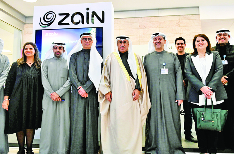 Dr Mohammad Al-Fares and Dr Rana Al Fares with Waleed Al-Khashti along with Zain’s team at the company’s booth.