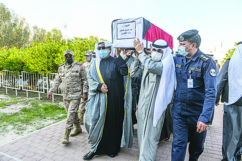 KUWAIT: A military funeral held for martyrs who were found in mass graves in Iraq. —KUNA