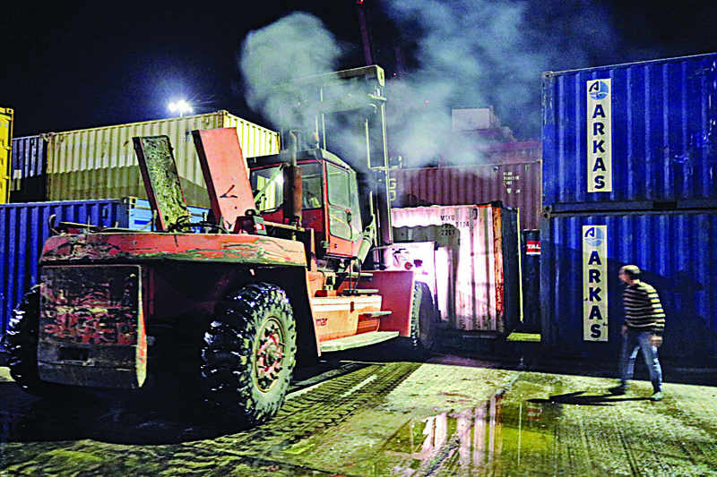 LATAKIA, Syria: An image grab from a handout picture released by the official Syrian Arab News Agency (SANA) yesterday shows a forklift moving containers during a fire at the Syrian port of Latakia. An Zionist air strike hit a shipment of Iranian weapons in the Syrian port of Latakia yesterday,  in the first such attack on the key facility, a war monitor said. - AFPnnnnn