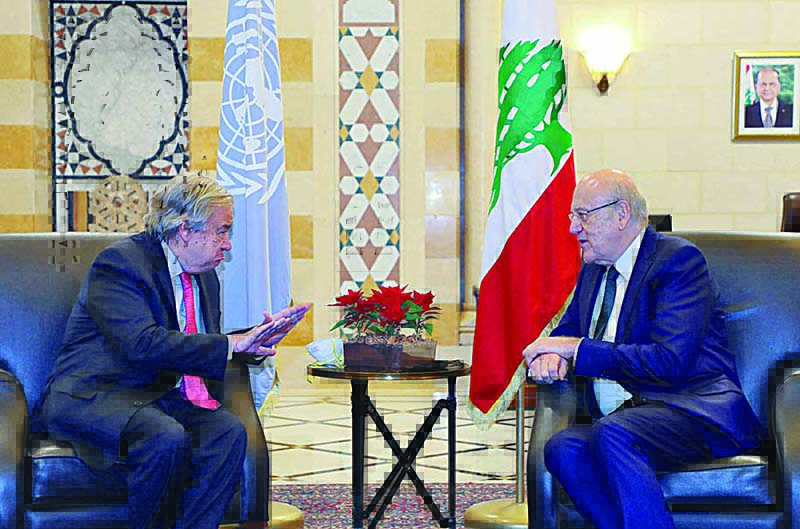 BEIRUT: A handout picture provided by the Lebanese photo agency Dalati and Nohra shows Lebanese PM Najib Mikati (R) meeting with UN Secretary-General Antonio Guterres (L) in the government palace in Beirut yesterday. —AFP