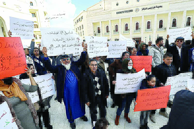 TRIPOLI: Local NGO activists gather for a demonstration at Algeria Square outside the Tripoli Municipality in the Libyan capital to protest against any possible postponement of the upcoming elections scheduled for December 24. —AFP