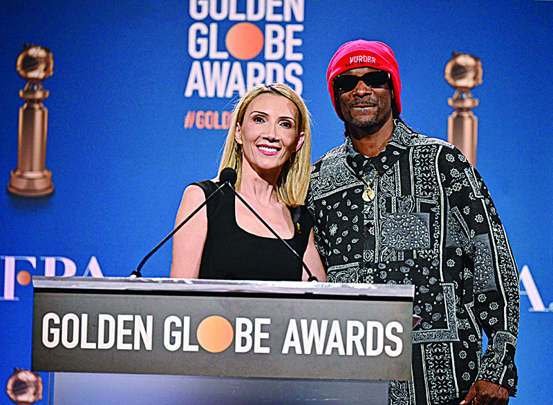 Helen Hoehne, president of the Hollywood Foreign Press Association (HFPA), and Snoop Dogg attend the nominations announcement for the 79th Golden Globe Awards, December 13, 2021. - AFP n
