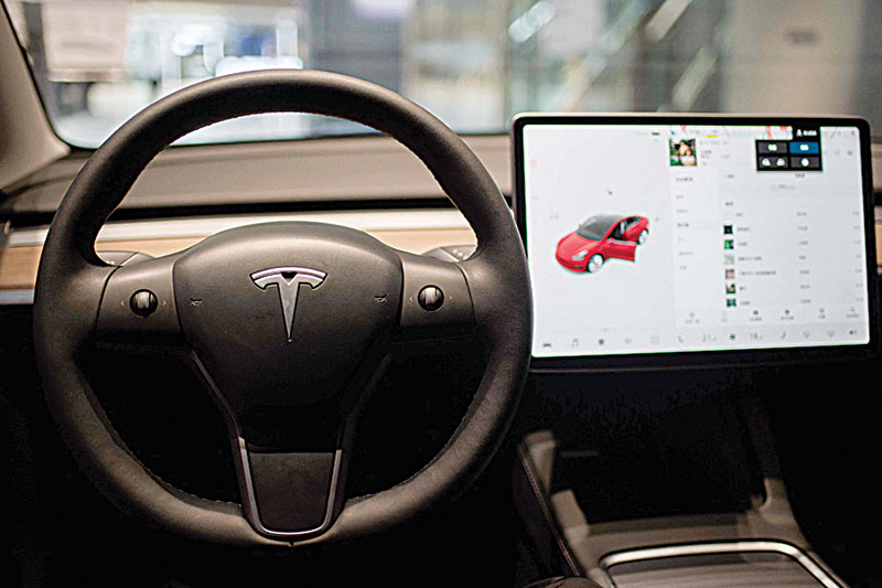 The inside of a Tesla car Model 3 is seen at a Tesla shop inside of a shopping Mall in Beijing. —AFP