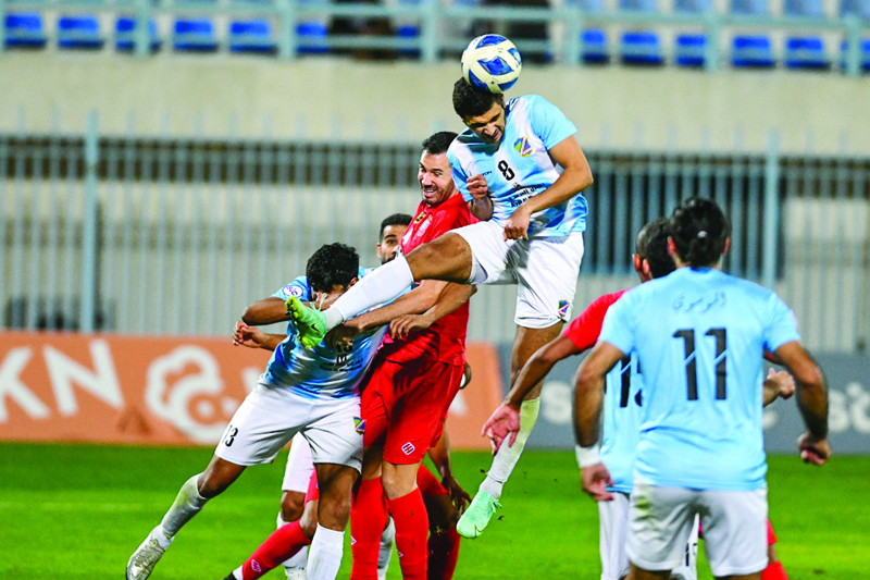 KUWAIT: Salmiya's Mohammad Al-Huwaidi #8 vies for the ball against Kuwait's Meshari Al-Azmi #4 during their match at Thamer Stadium in Salmiya on Friday. - KUNA photon