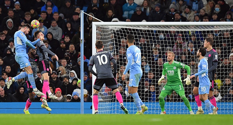 MANCHESTER: Manchester City’s French defender Aymeric Laporte (left) scores his team’s fifth goal during the English Premier League football match between Manchester City and Leicester City yesterday.— AFP