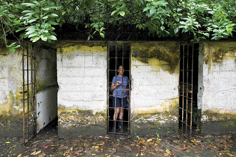 A tourist poses for a picture inside a cell at what was the prison at Gorgona Island, in the Pacific Ocean, off southwestern Colombia. — AFP photos