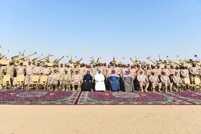 KUWAIT: His Highness the Prime Minister Sheikh Sabah Al-Khaled Al-Hamad Al-Sabah in a group photo during his visit to Al-Udaire' training range yesterday. - KUNA photosn