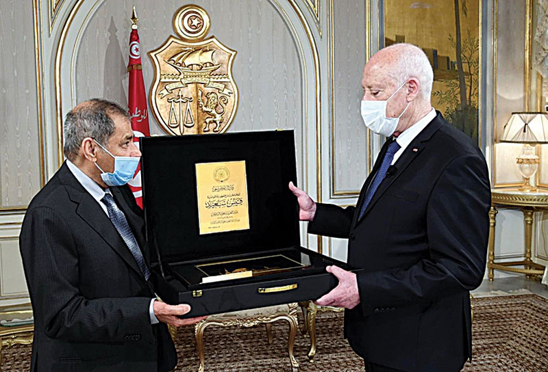 TUNIS: Tunisian President Kais Saied receives an honorary shield from Chairman of Abdulaziz Saud Al-Babtain Cultural Foundation. — KUNAn