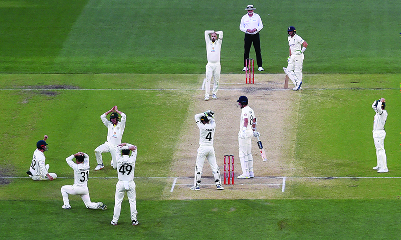 ADELAIDE: Australia appeal for a decision against England batsman Stuart Broad (3rd right) on the final day of the second Ashes cricket Test match in Adelaide yesterday. — AFP