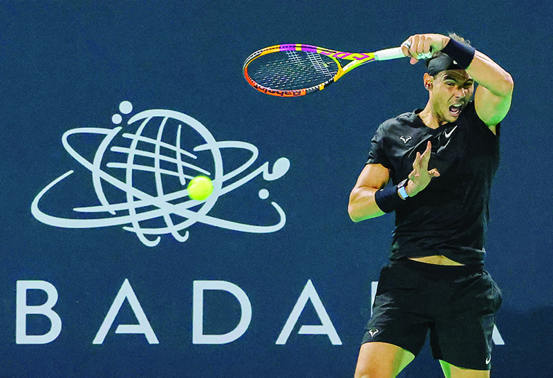 ABU DHABI: In this file photo, Spain’s Rafael Nadal returns the ball to Canada’s Denis Shapovalov (unseen) during the third-place play-off match of the Mubadala World Tennis Championship. Rafael Nadal said he has tested positive for COVID-19. — AFP