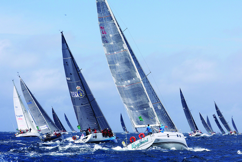 SYDNEY: Yacht Kayimai (center) competes at the start of the Sydney to Hobart yacht race yesterday. — AFP