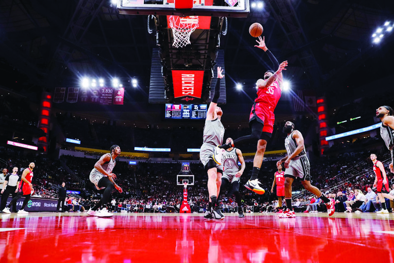 HOUSTON: Christian Wood #35 of the Houston Rockets shoots a basket over Blake Griffin #2 of the Brooklyn Nets during the first half at Toyota Center in Houston, Texas. – AFPnn