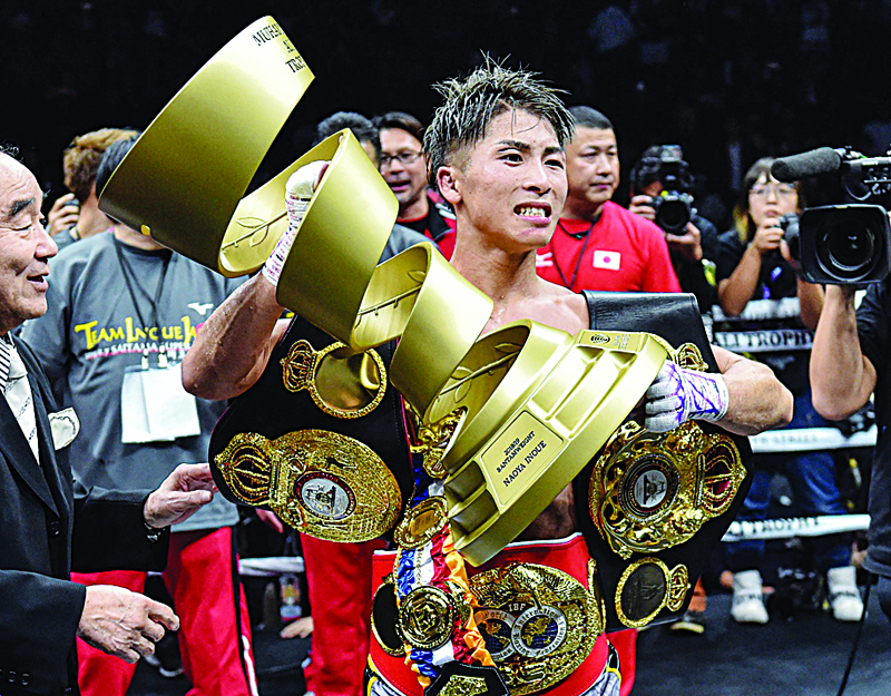 Naoya Inoue of Japan celebrates his win over Nonito Donaire of Philippines after their World Boxing Super Series bantamweight final at Saitama Super Arena in Saitama. - AFP n