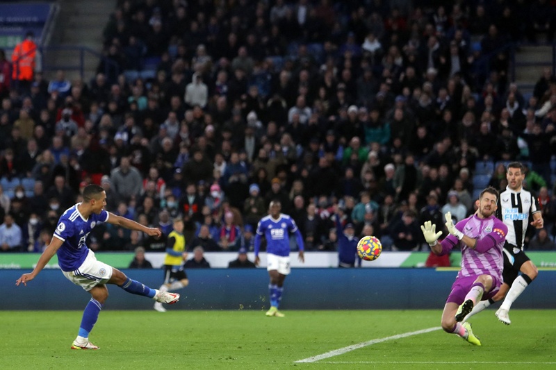 LEICESTER: Leicester City's Belgian midfielder Youri Tielemans (left) shoots past Newcastle United's Slovakian goalkeeper Martin Dubravka to score their third goal during the English Premier League football match between Leicester City and Newcastle United yesterday. - AFP n